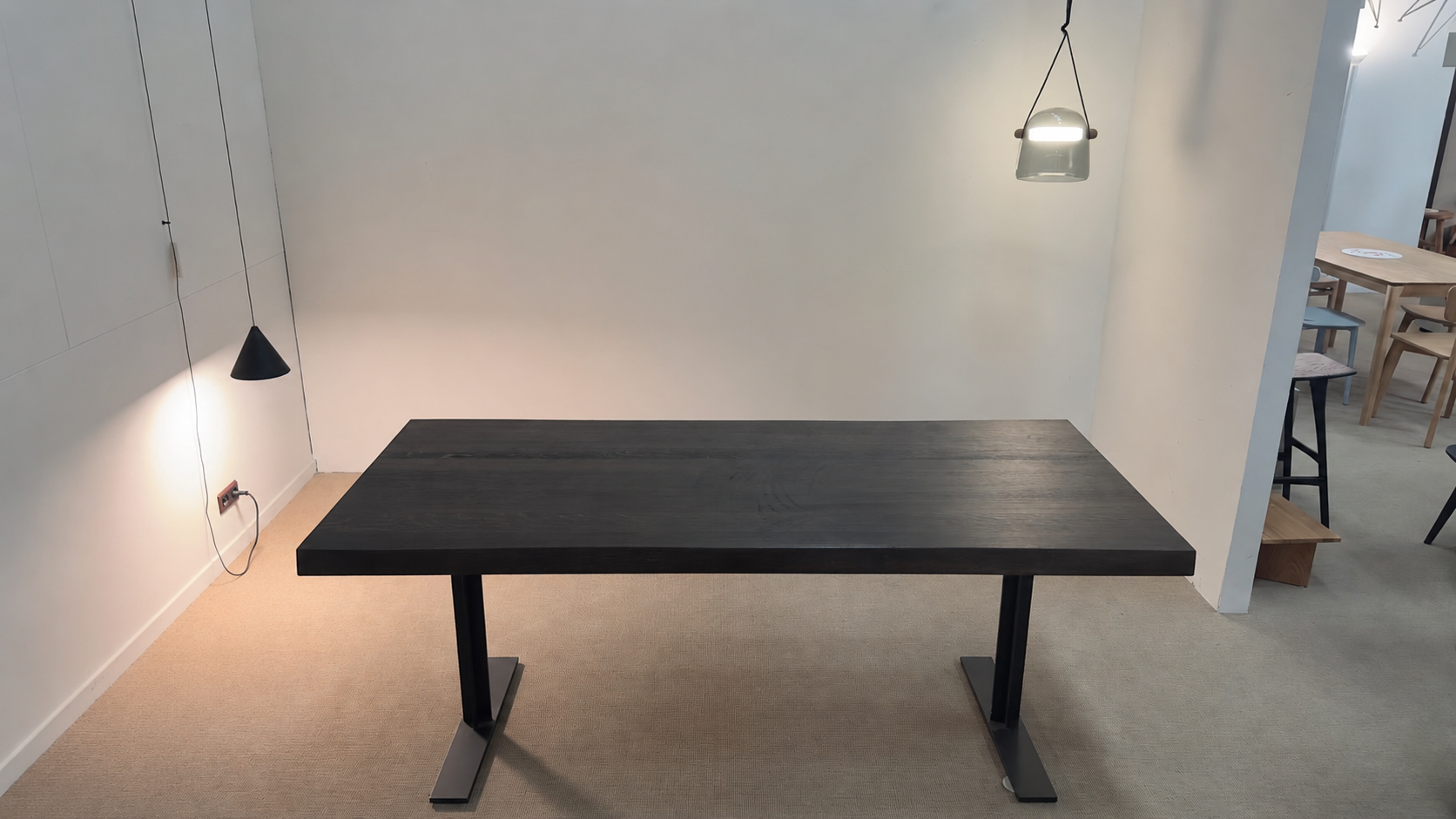 Michel Denolf LARRY dining table made of charred chestnut wood in the dining area