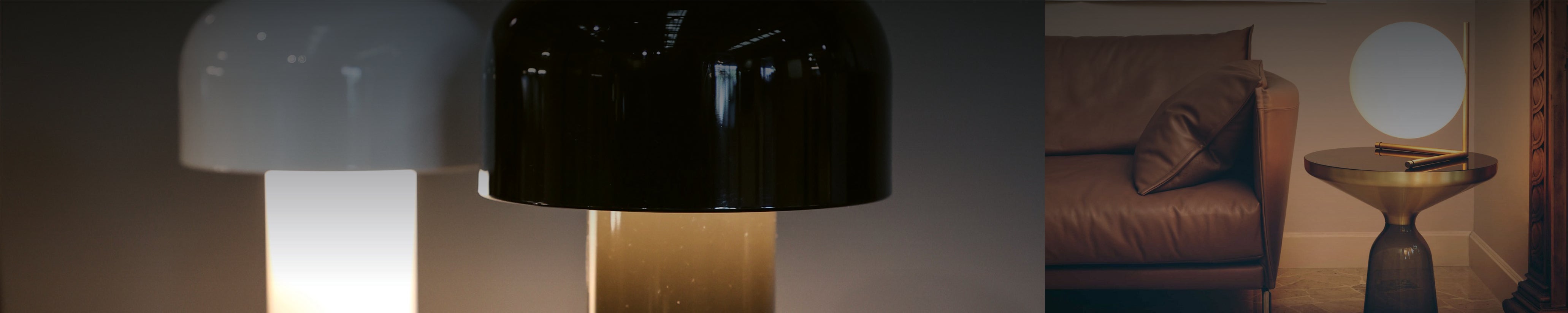 Elegante Tischlampe mit weißem Glaskörper und goldfarbenem Gestell auf runder Konsole