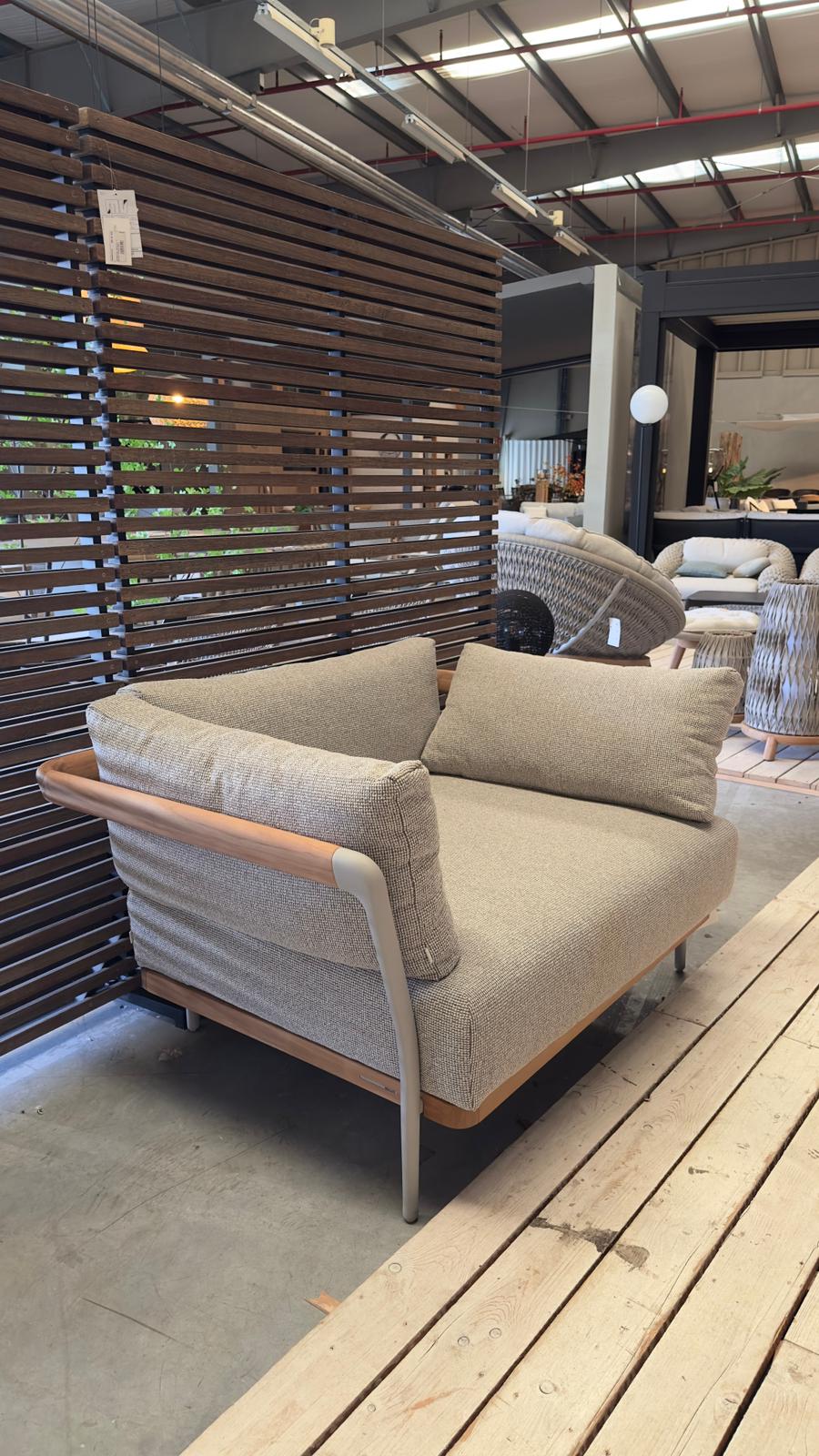 Manutti FLOWS teak garden armchair and AF13 Flint on display in the garden section