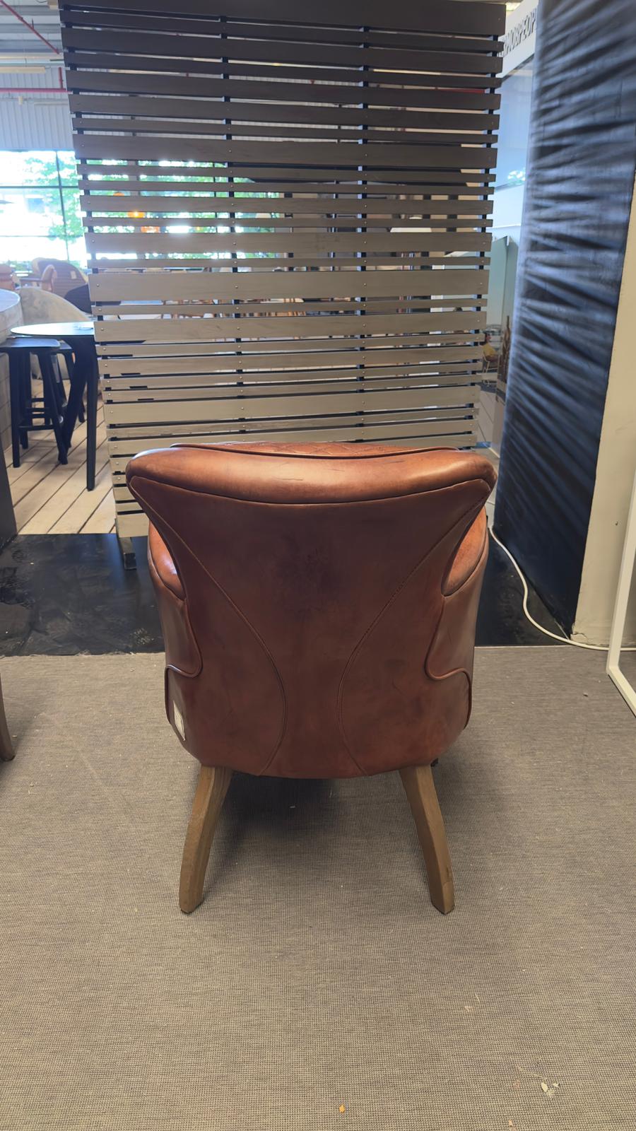 Timothy Oulton SIDE SADDLE Leather Chair on display in the showroom