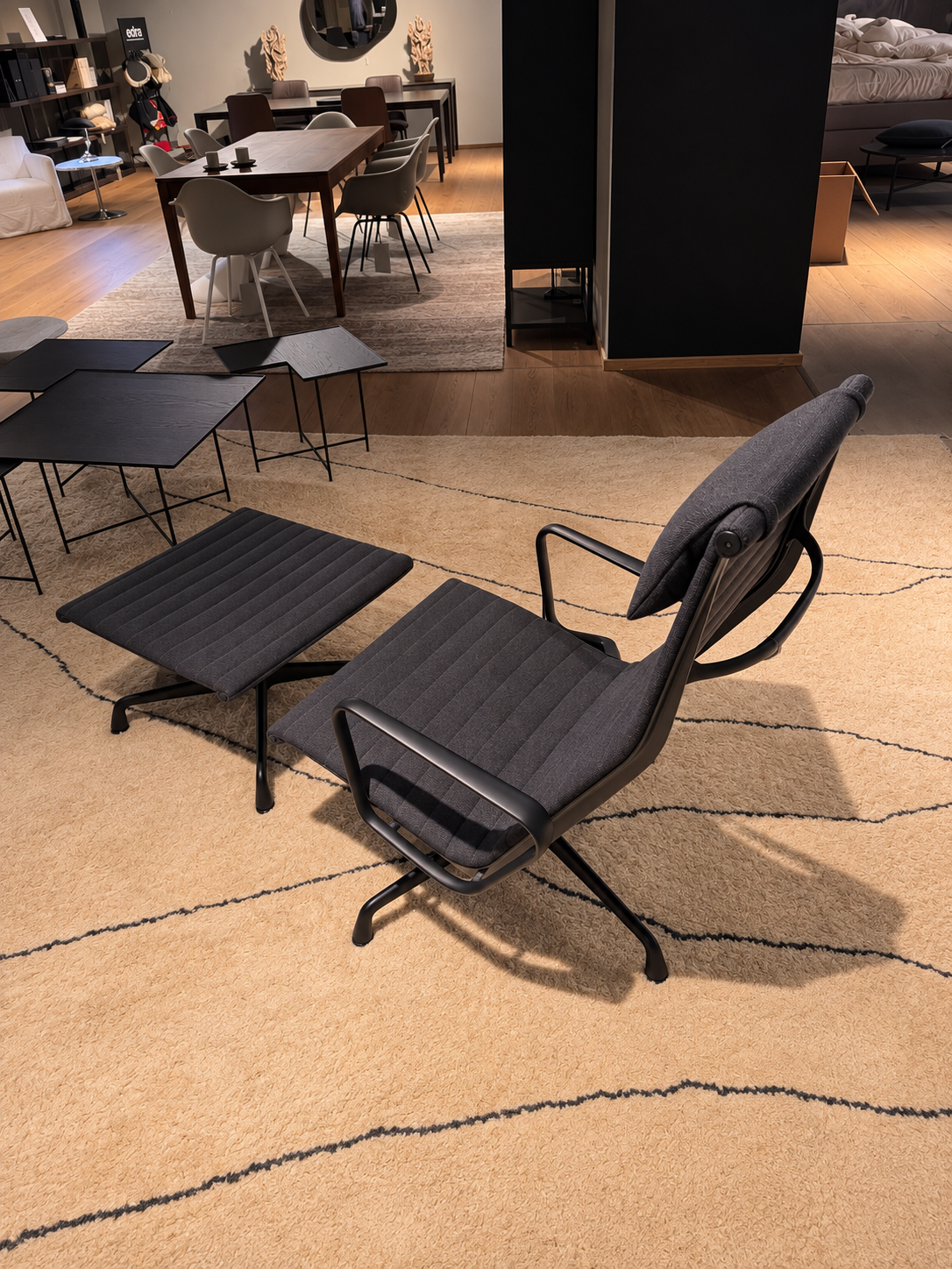 Vitra EAMES EA 125 lounge chair with Hopsak upholstery, on display in the showroom