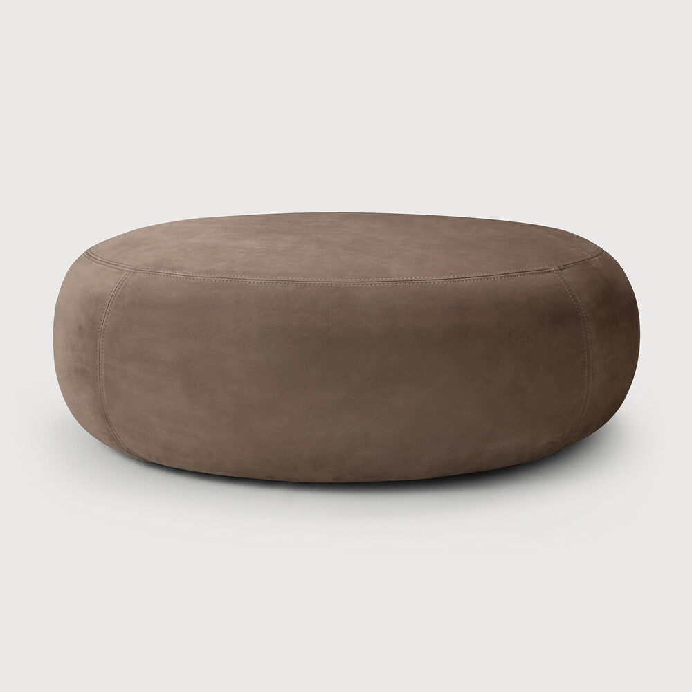 Ethnicraft ORB ottoman with fawn nubuck leather upholstery, a low silhouette, and an organically rounded shape when viewed from the front.