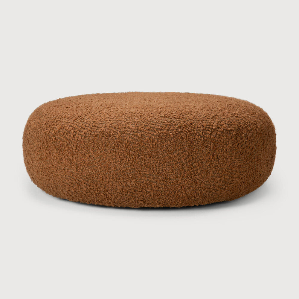Ethnicraft ORB ottoman with a Cinnamon fabric cover, a low silhouette, and an organically rounded shape as seen from the front.