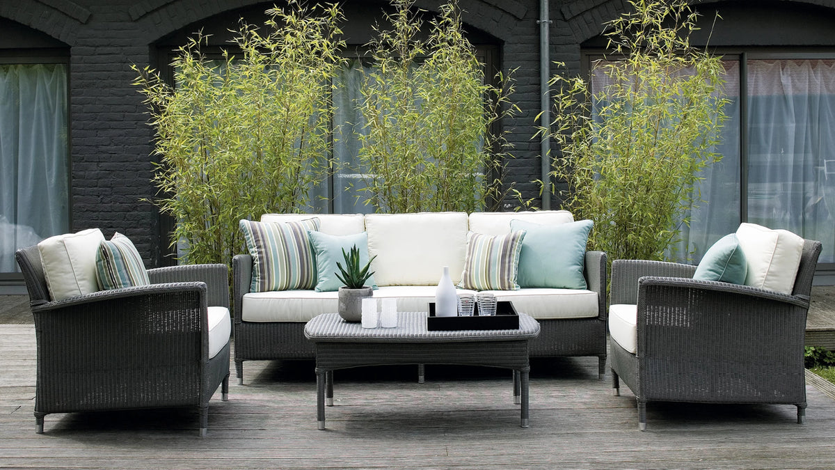 Vincent Sheppard DOVILE Garden Sofa with Canvas Pillows in the Outdoor Lounge Area