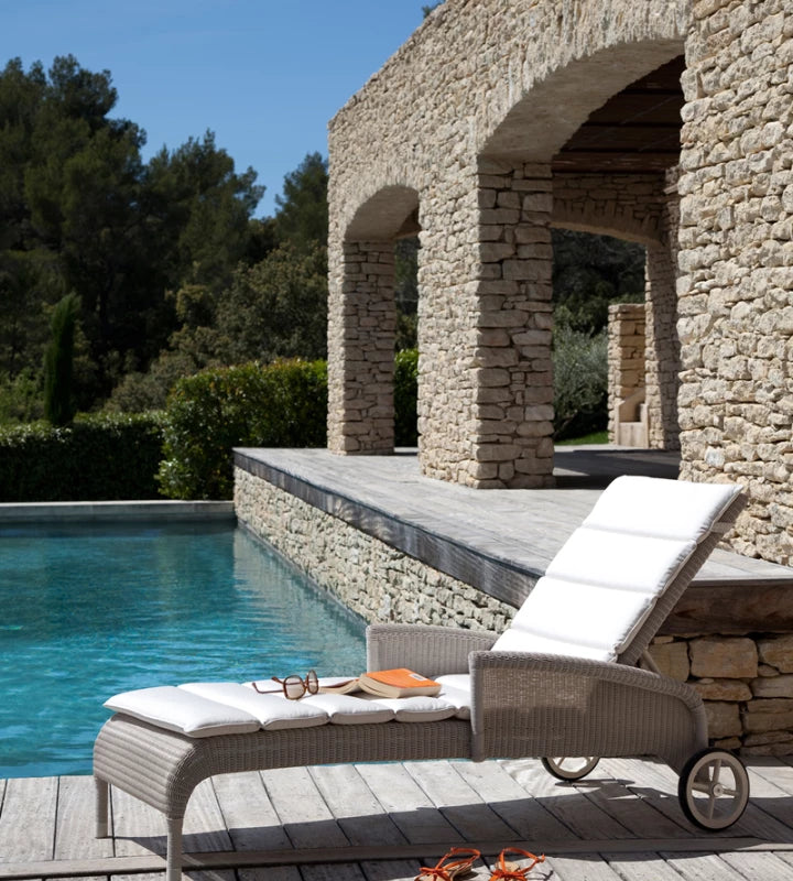 Vincent Sheppard SAFI Sun Lounger with Armrests and Canvas Pillows by the Pool